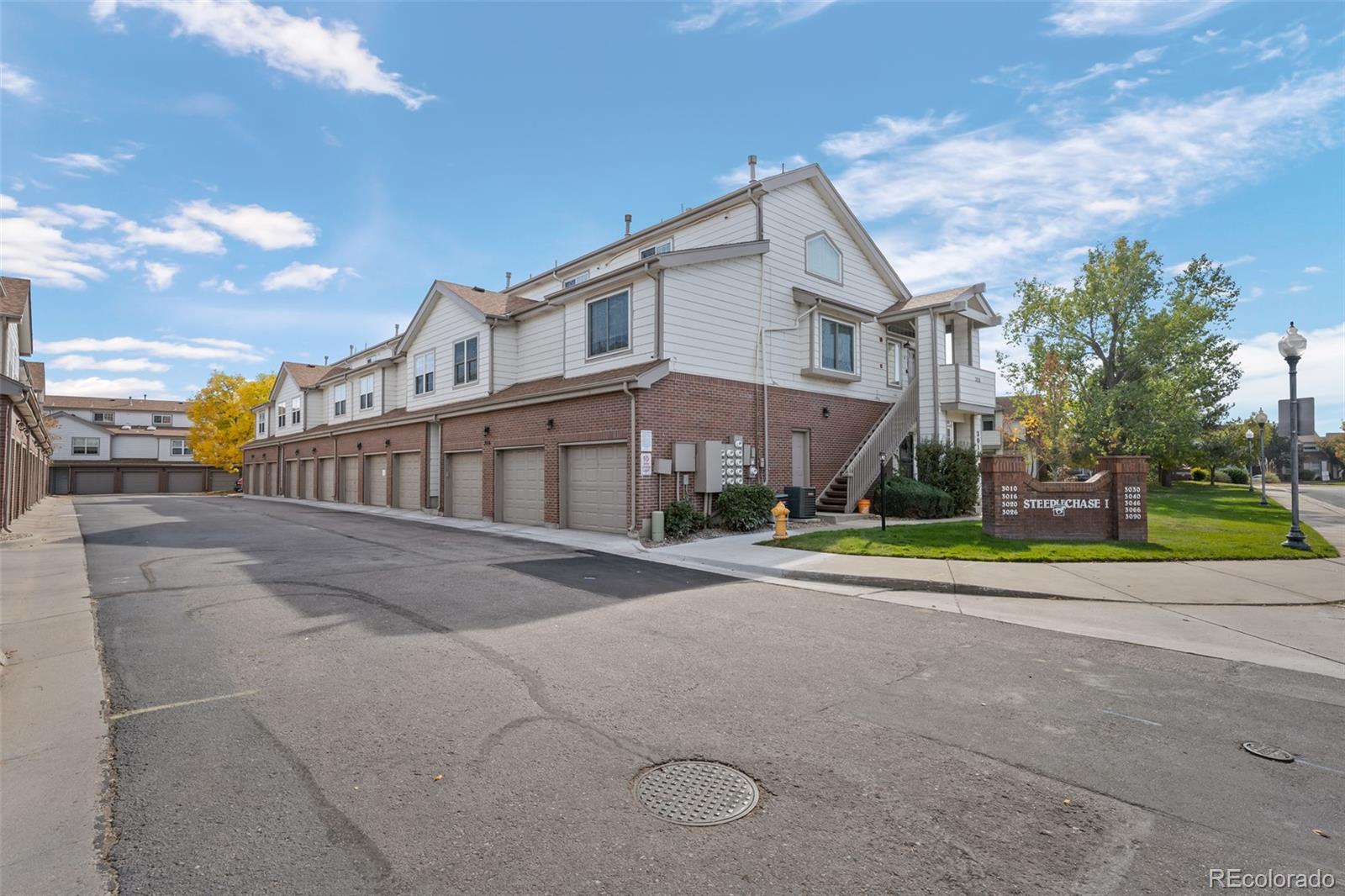 3016 West Prentice Avenue, Unit D Littleton, CO 80123 - Photo 24 of 28 a view of a street with a houses