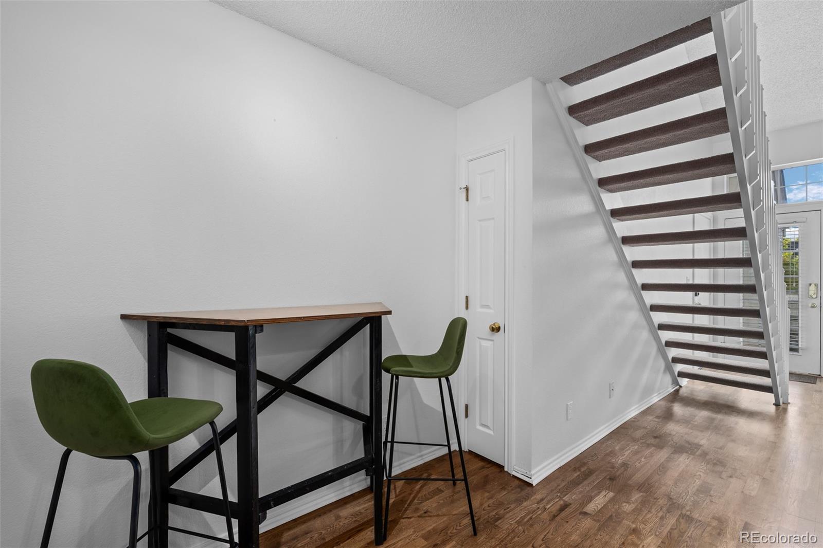 3016 West Prentice Avenue, Unit D Littleton, CO 80123 - Photo 10 of 28 a view of a hallway with chairs