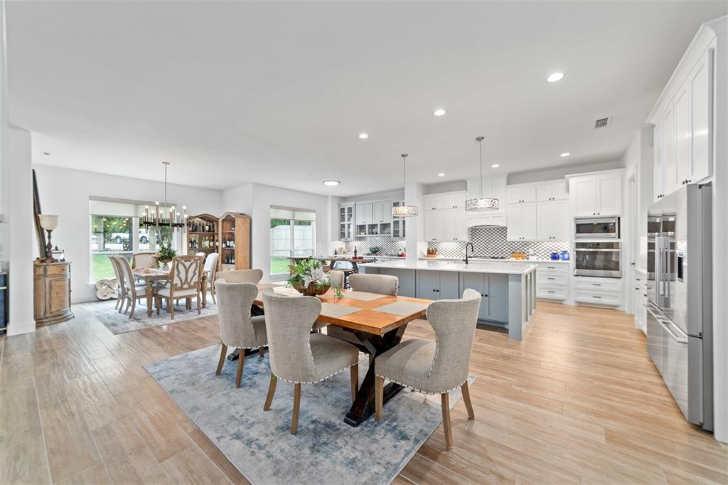 582 Oak Point Drive May, TX 76857 - Photo 14 of 37 a view of a dining room with furniture and wooden floor