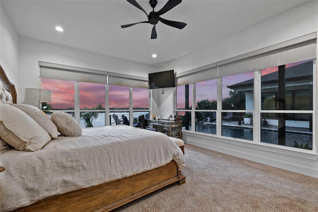 582 Oak Point Drive May, TX 76857 - Photo 15 of 37 a bedroom with a large bed and a large window