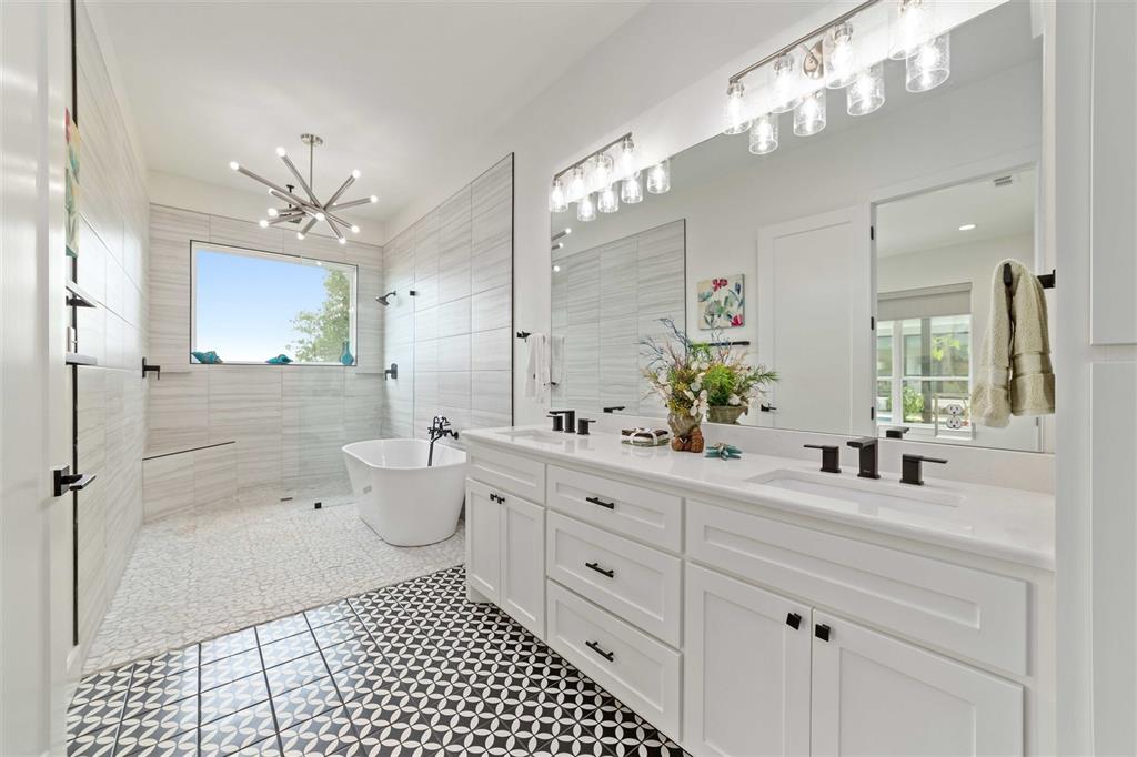 582 Oak Point Drive May, TX 76857 - Photo 18 of 37 a bathroom with a double vanity sink mirror and shower