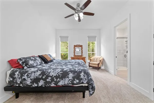 a bathroom with a shower sink and mirror
