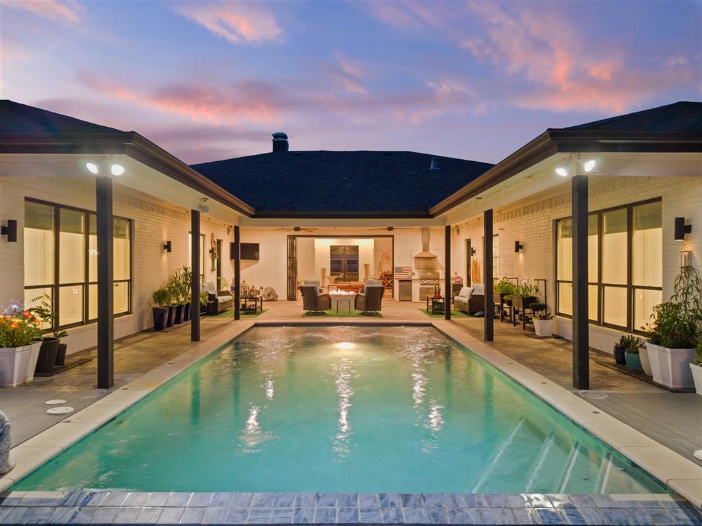 582 Oak Point Drive May, TX 76857 - Photo 32 of 37 a view of a swimming pool with outdoor seating