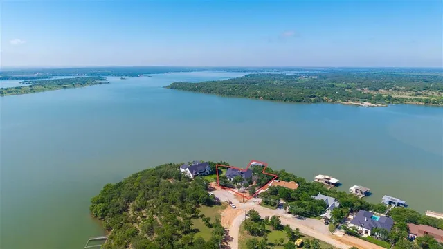 an aerial view of a house with a lake view