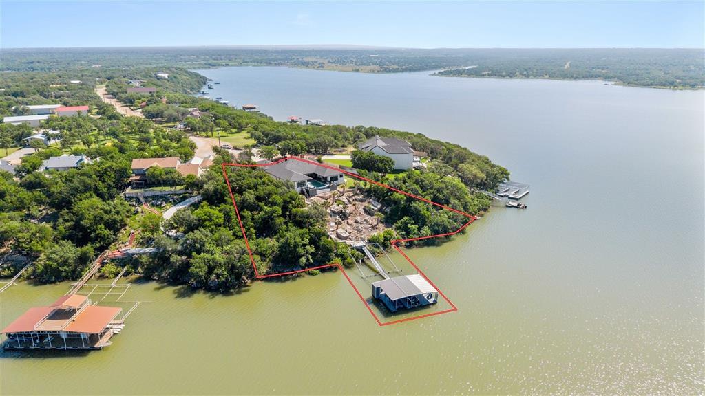 582 Oak Point Drive May, TX 76857 - Photo 37 of 37 an aerial view of a house with a lake view