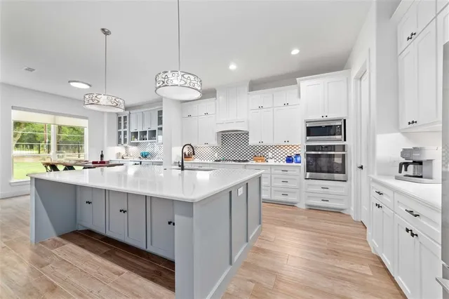 a kitchen with cabinets appliances and cabinets