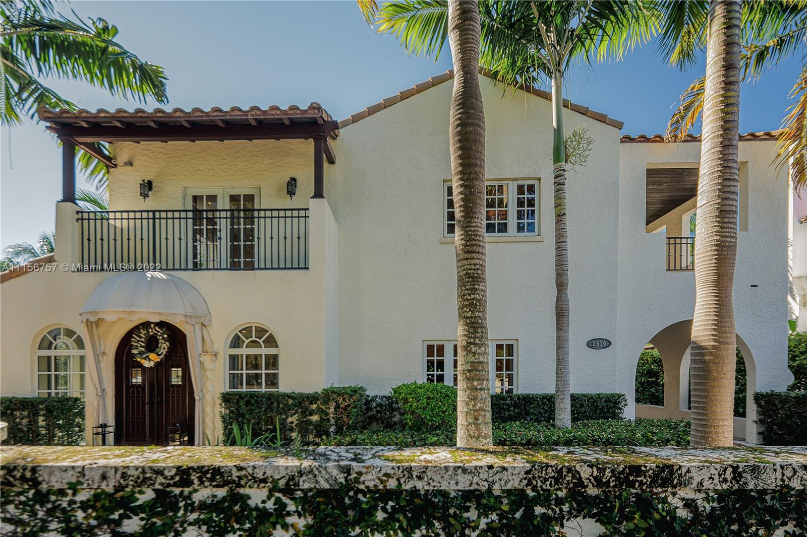 2914 Alton Road Miami Beach, FL 33140 - Photo 13 of 70 a front view of a house with garden
