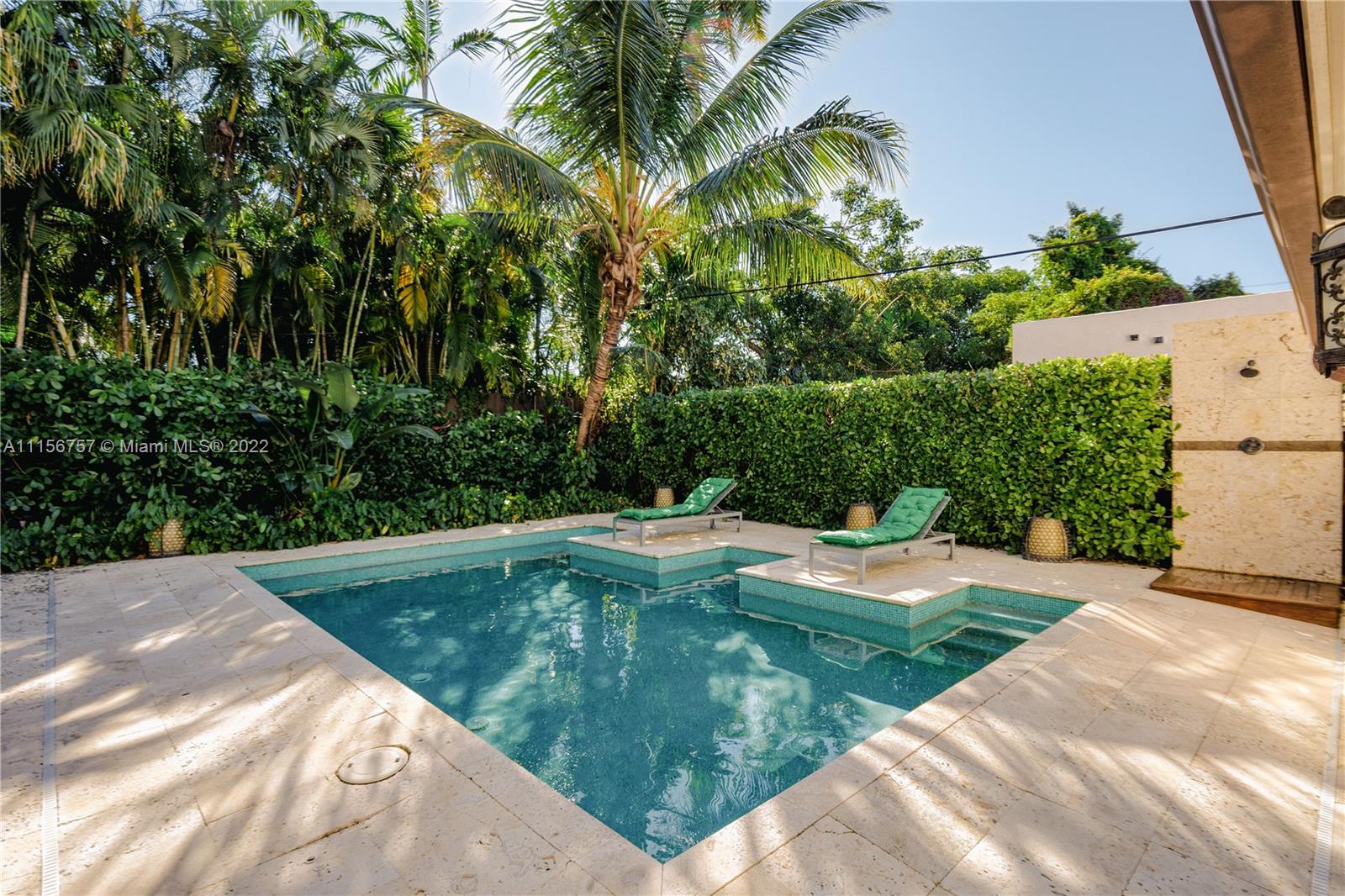 2914 Alton Road Miami Beach, FL 33140 - Photo 14 of 70 a view of a swimming pool with a backyard