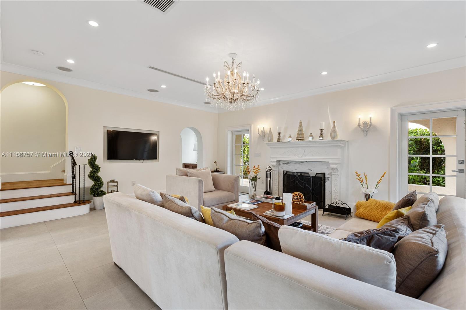 2914 Alton Road Miami Beach, FL 33140 - Photo 18 of 70 a living room with furniture and a fireplace