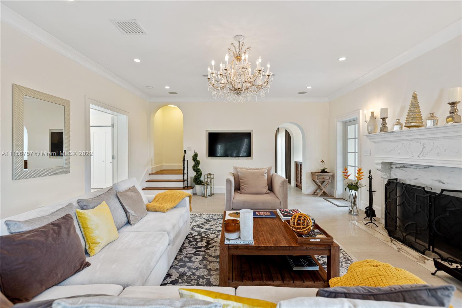 2914 Alton Road Miami Beach, FL 33140 - Photo 20 of 70 a living room with furniture fireplace and a mirror