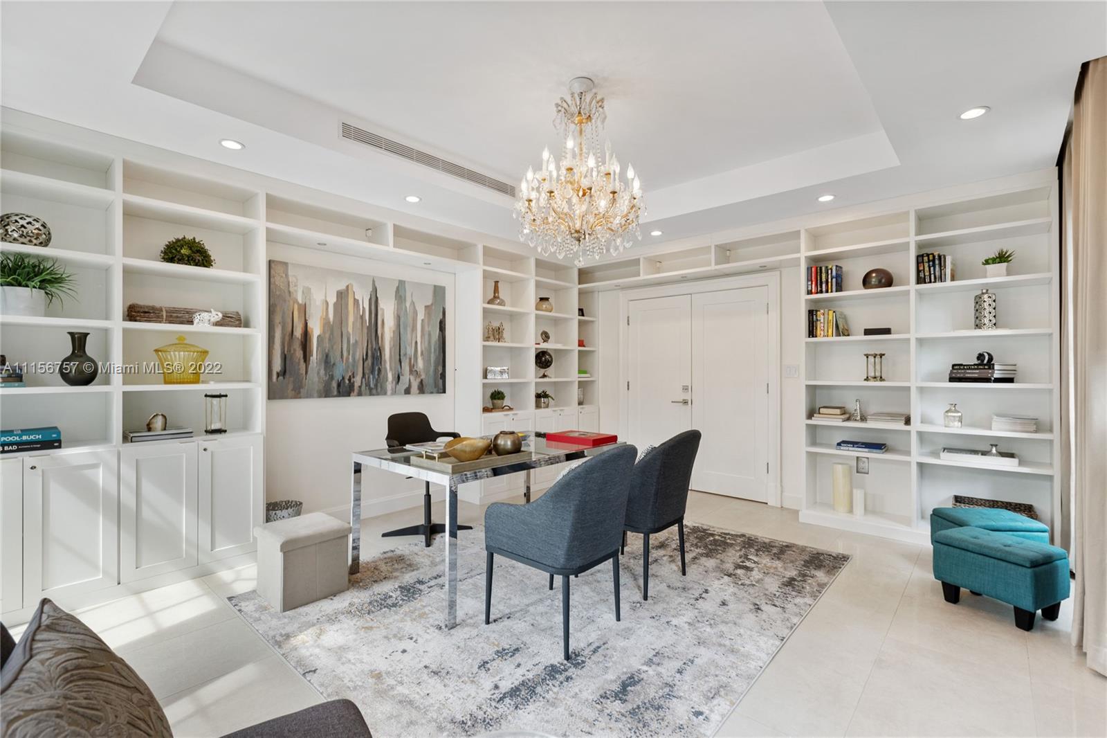 2914 Alton Road Miami Beach, FL 33140 - Photo 2 of 70 a living room with furniture and a chandelier