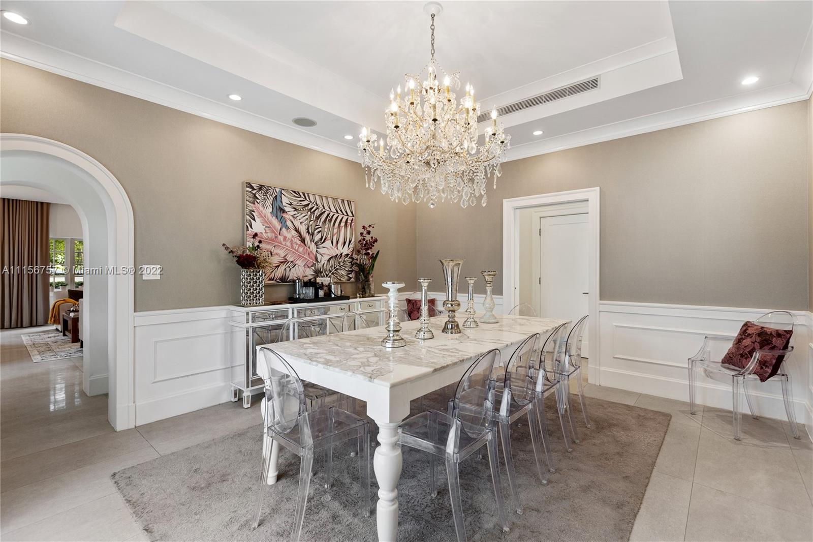 2914 Alton Road Miami Beach, FL 33140 - Photo 25 of 70 a view of a dining room with furniture and chandelier