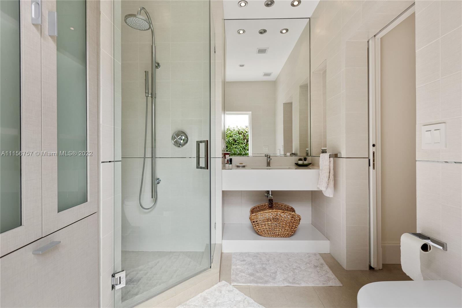 2914 Alton Road Miami Beach, FL 33140 - Photo 31 of 70 a bathroom with a sink and shower