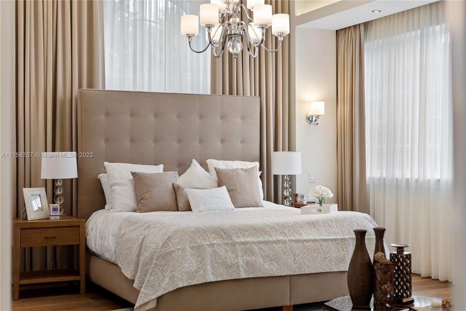 2914 Alton Road Miami Beach, FL 33140 - Photo 39 of 70 a bedroom with a bed a mirror and a window