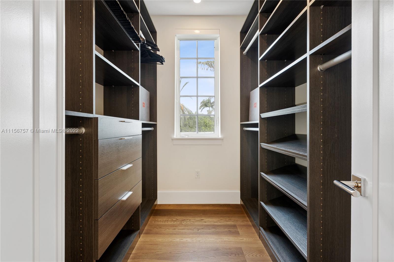 2914 Alton Road Miami Beach, FL 33140 - Photo 42 of 70 a view of walk in closet with empty racks