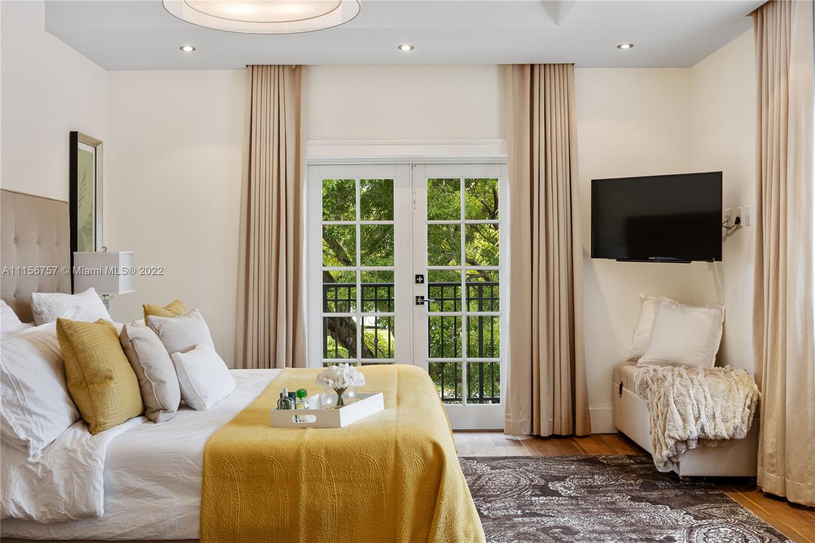 2914 Alton Road Miami Beach, FL 33140 - Photo 46 of 70 a bedroom with a bed and a television