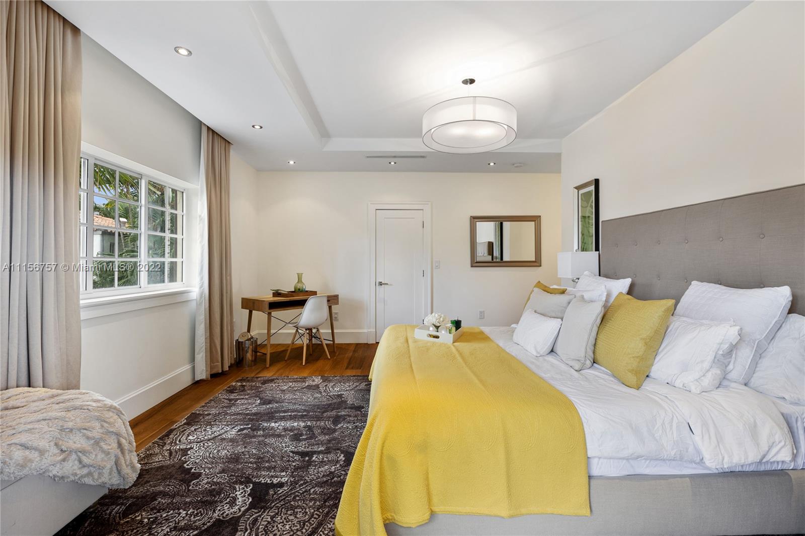 2914 Alton Road Miami Beach, FL 33140 - Photo 48 of 70 a spacious bedroom with a bed and a window