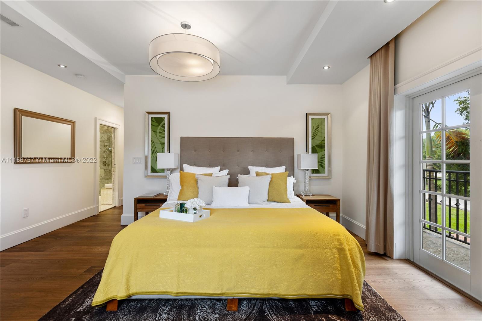 2914 Alton Road Miami Beach, FL 33140 - Photo 49 of 70 a bed sitting in a spacious bedroom next to a window