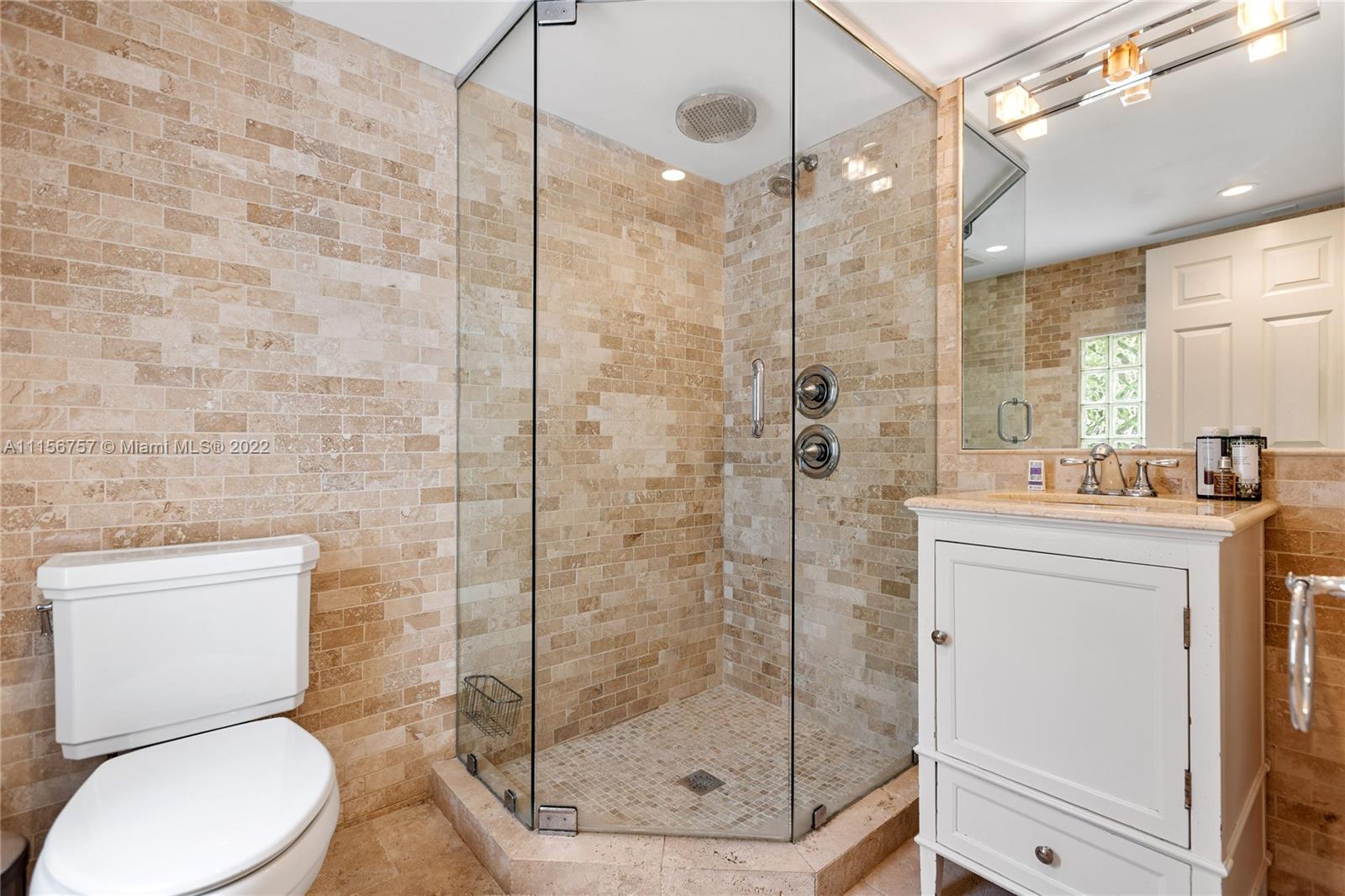 2914 Alton Road Miami Beach, FL 33140 - Photo 61 of 70 a bathroom with a shower a toilet and sink