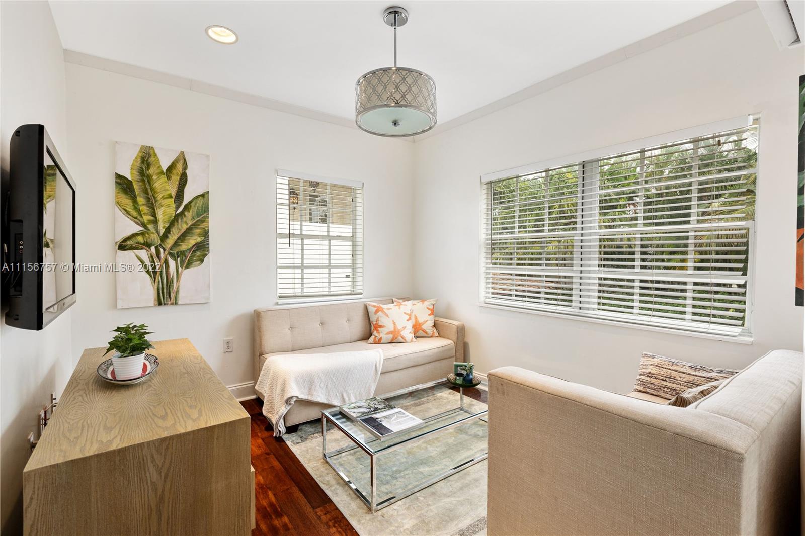2914 Alton Road Miami Beach, FL 33140 - Photo 63 of 70 a living room with furniture and a table