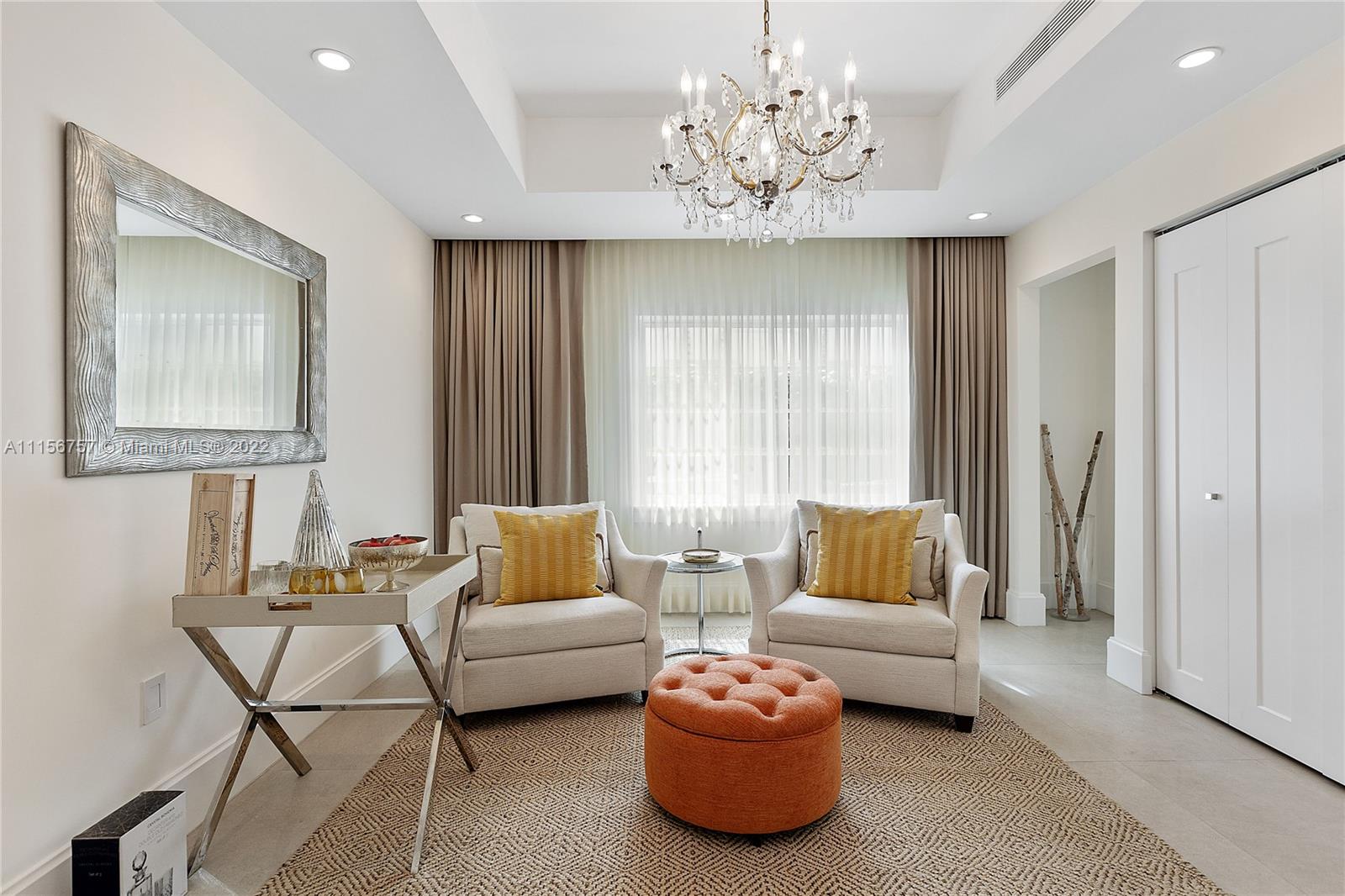 2914 Alton Road Miami Beach, FL 33140 - Photo 9 of 70 a living room with furniture and a chandelier