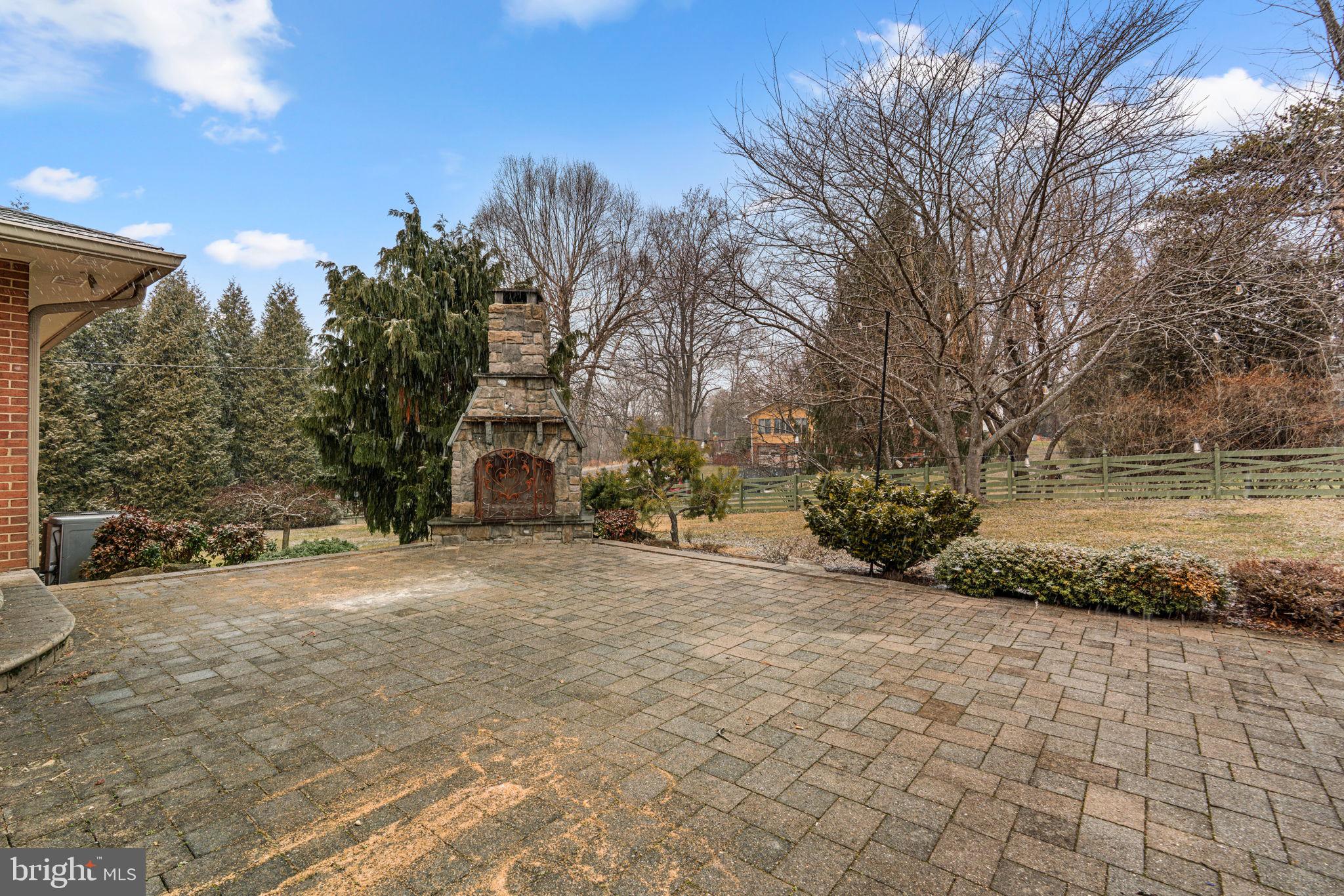 9122 Northfield Road Ellicott City, MD 21042 - Photo 51 of 60 Patio with Outdoor Stone Fireplace