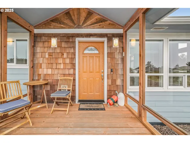 a dining room with a glass top table and chairs