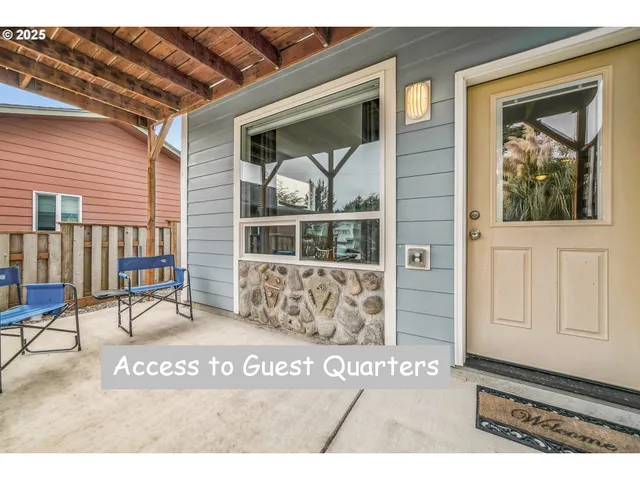 a view of a bedroom with wooden floor and a window