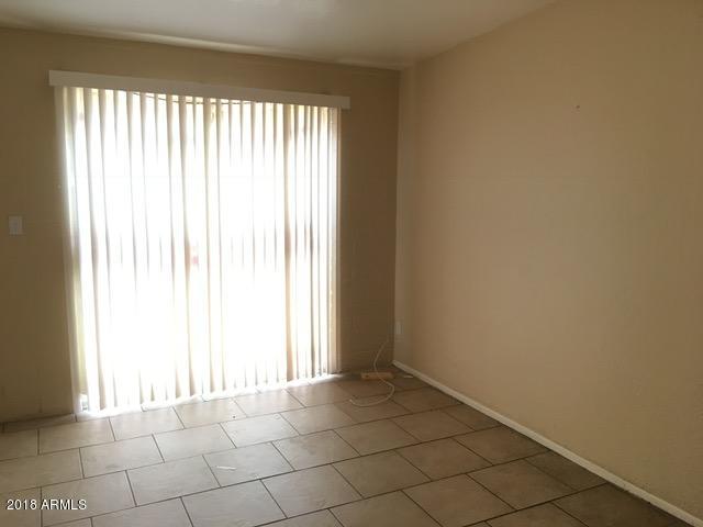 7110 North 68th Avenue, Unit 1 Glendale, AZ 85303 - Photo 21 of 22 a view of an empty room and window