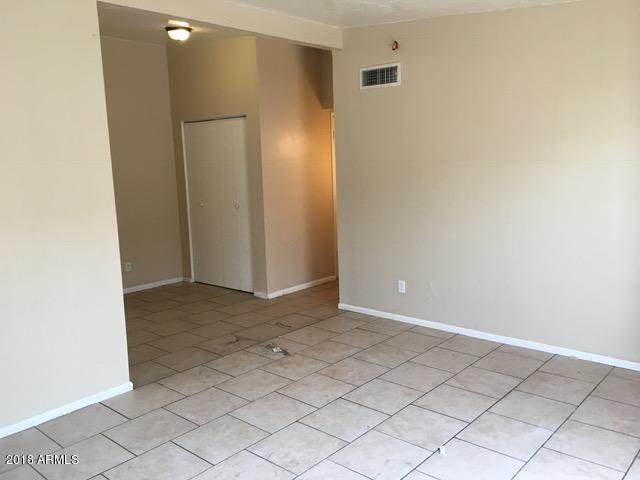 7110 North 68th Avenue, Unit 1 Glendale, AZ 85303 - Photo 6 of 22 a view of an empty room