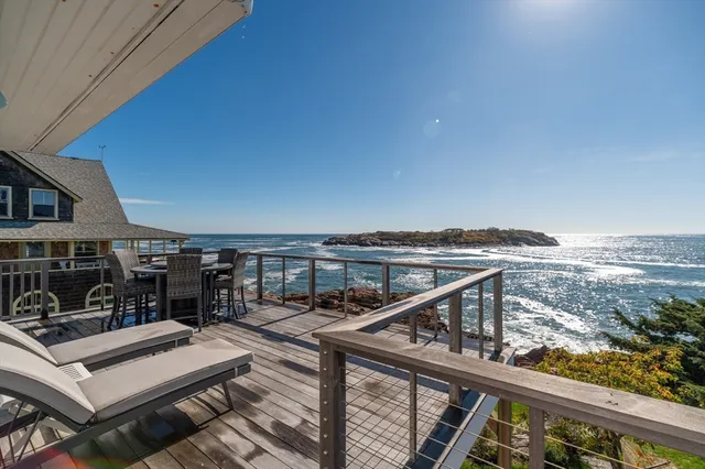 a view of a balcony and chairs
