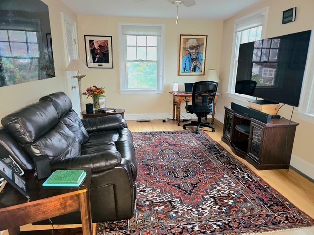 25 Salt Island Road Gloucester, MA 01930 - Photo 17 of 37 a living room with furniture and a flat screen tv