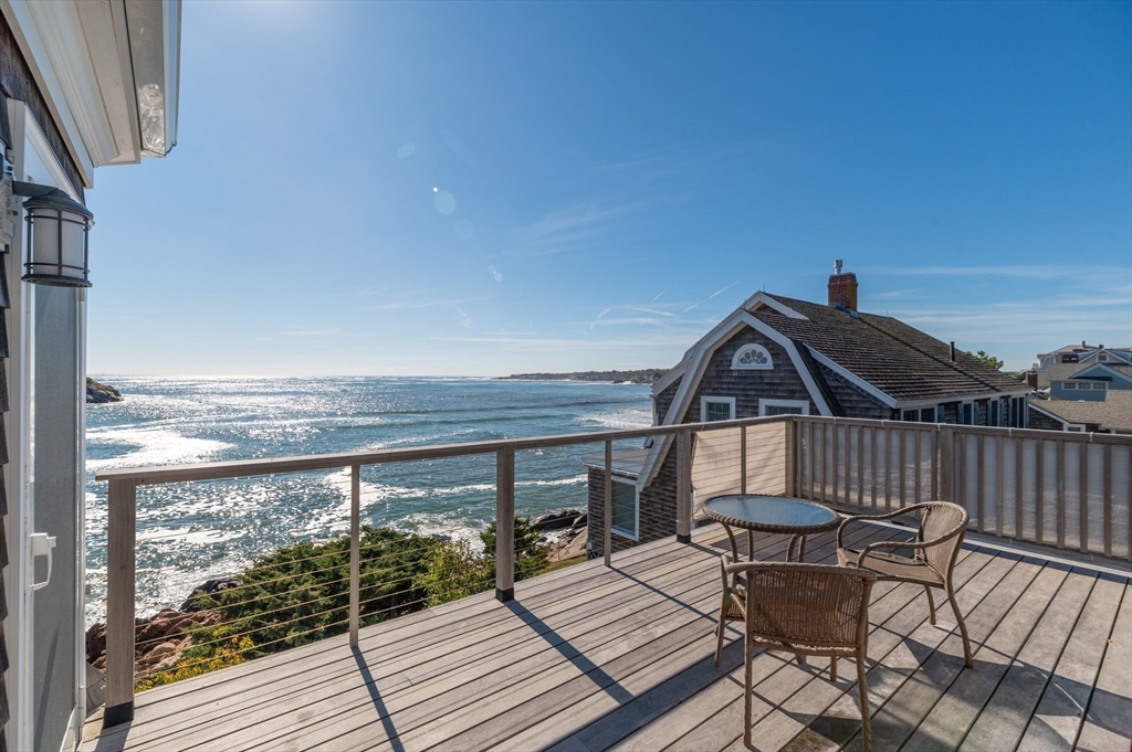 25 Salt Island Road Gloucester, MA 01930 - Photo 20 of 36 a view of balcony with wooden floor and outdoor seating