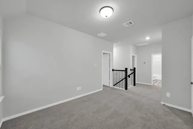 a sign that is sitting in front of flowers