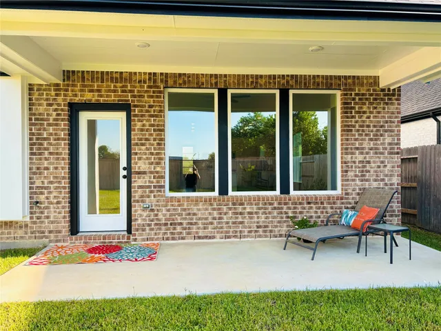 a view of swimming pool and outdoor seating