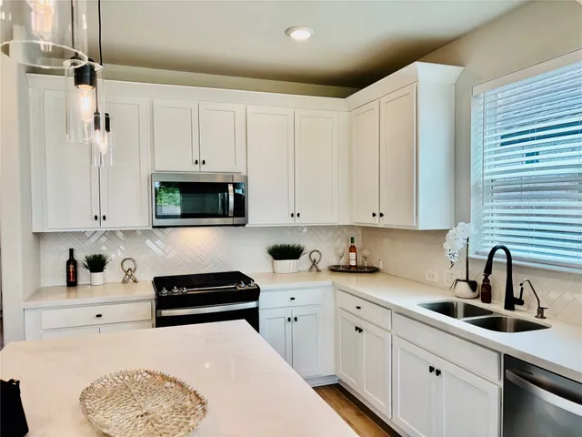 a bedroom with a bed couch and window