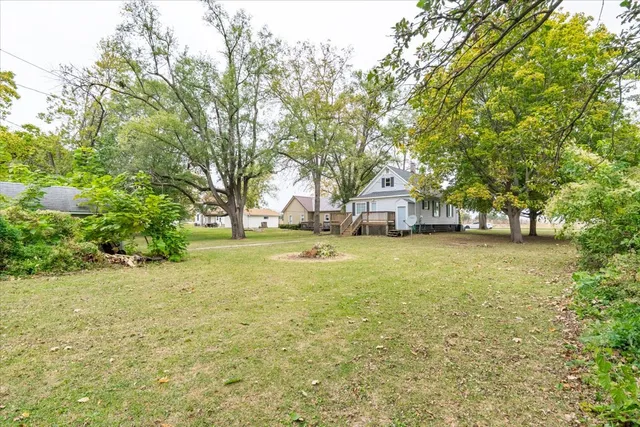 a house view with swimming pool in front of it