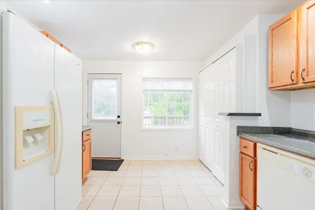 a view of a kitchen with a sink and a window