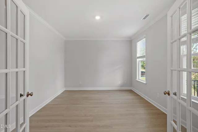 a view of an empty room with a window