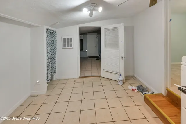 a bathroom with a shower and a shower curtain