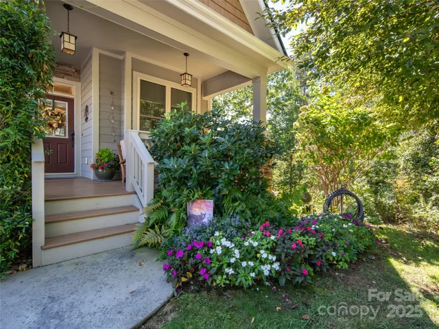 a view of a house with potted plants