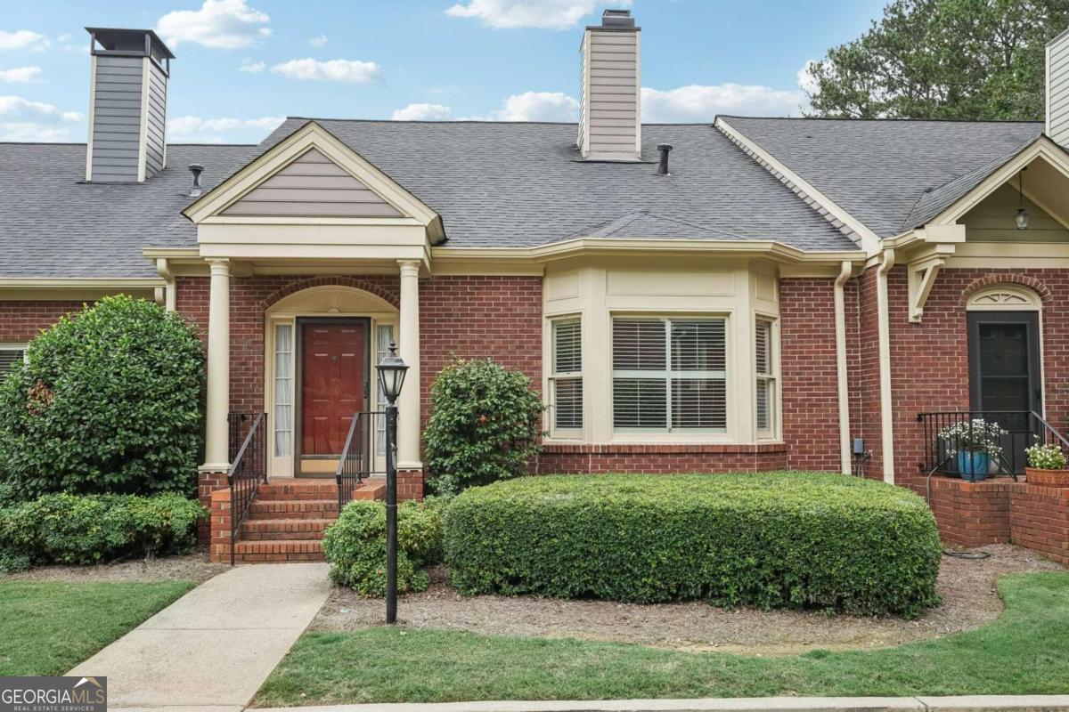 1418 Winston Place, Unit 1418 Decatur, GA 30033 - Photo 1 of 1 a front view of a house with a yard