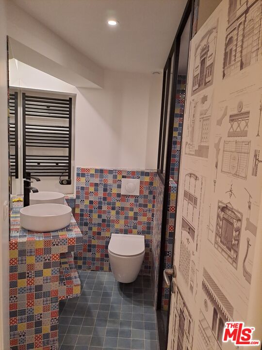 50 Rue De Crimée Coppell, IDF 75019 - Photo 3 of 9 a bathroom with a toilet and a shower