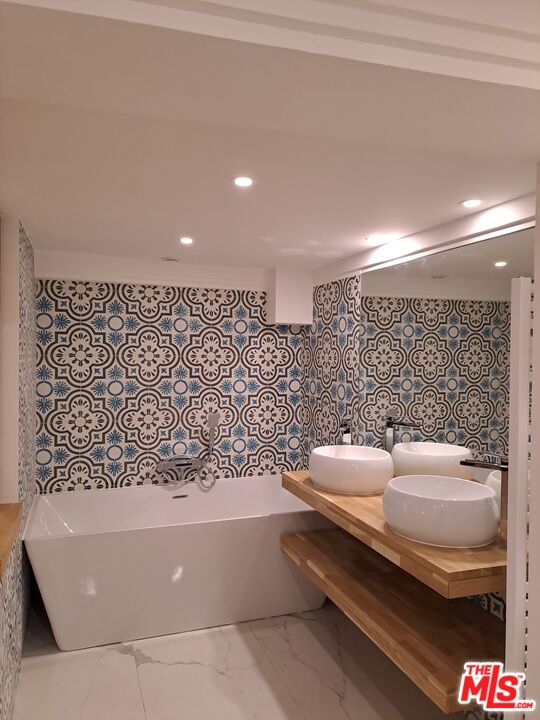 50 Rue De Crimée Coppell, IDF 75019 - Photo 4 of 9 a bathroom with a bathtub and shower