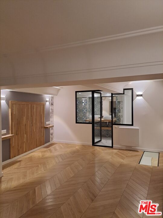 50 Rue De Crimée Coppell, IDF 75019 - Photo 6 of 9 a view of an empty room with window and cabinet
