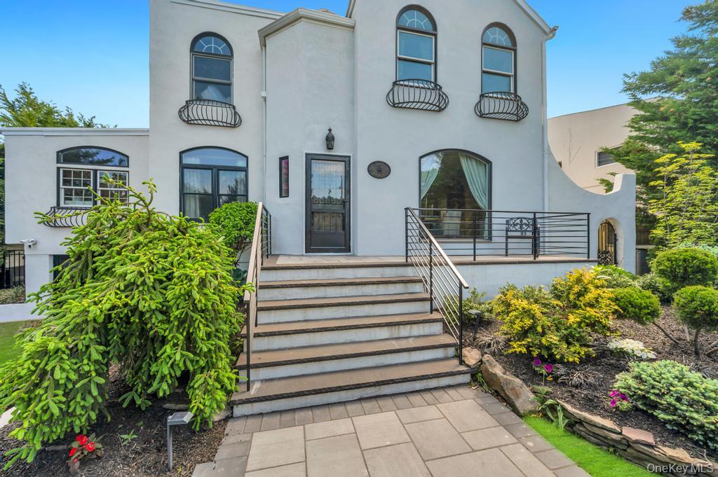 357 Wynsum Avenue Merrick, NY 11566 - Photo 3 of 40 a front view of a house with a garden