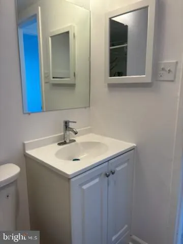 a bathroom with a sink and mirror