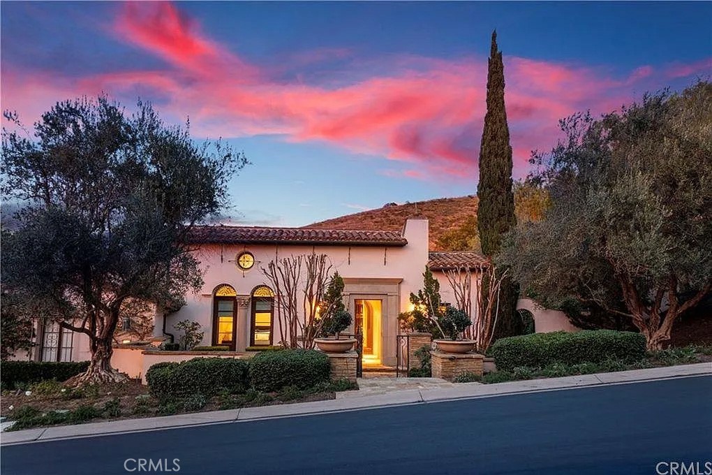 59 Vernal Spring Irvine, CA 92603 - Photo 1 of 33 a front view of a house with garden