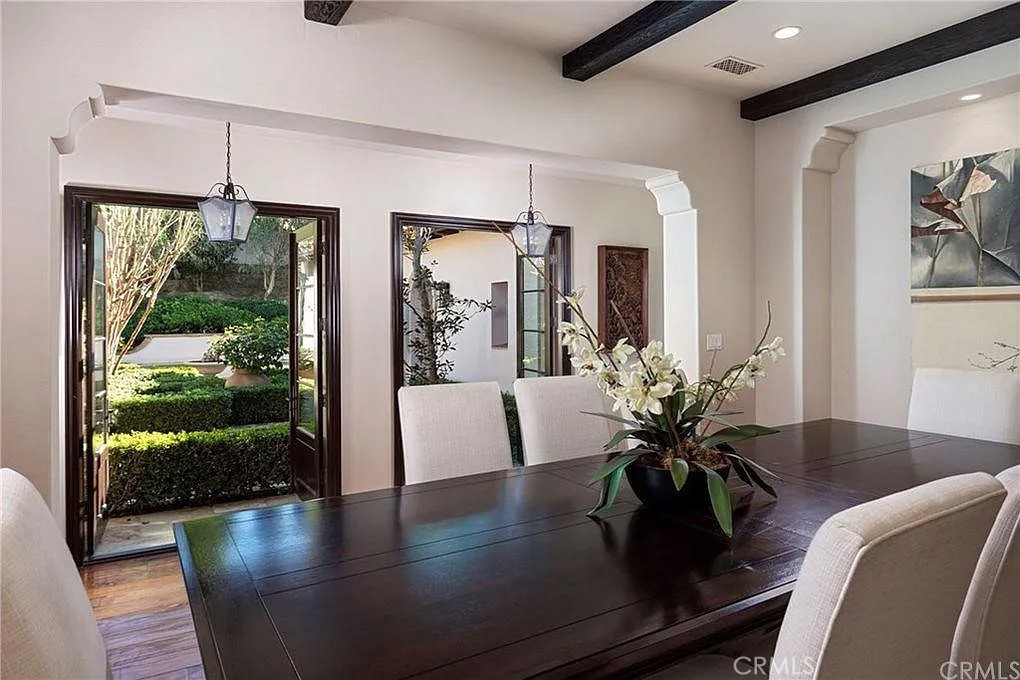 59 Vernal Spring Irvine, CA 92603 - Photo 14 of 33 a view of a dining room with furniture window and wooden floor