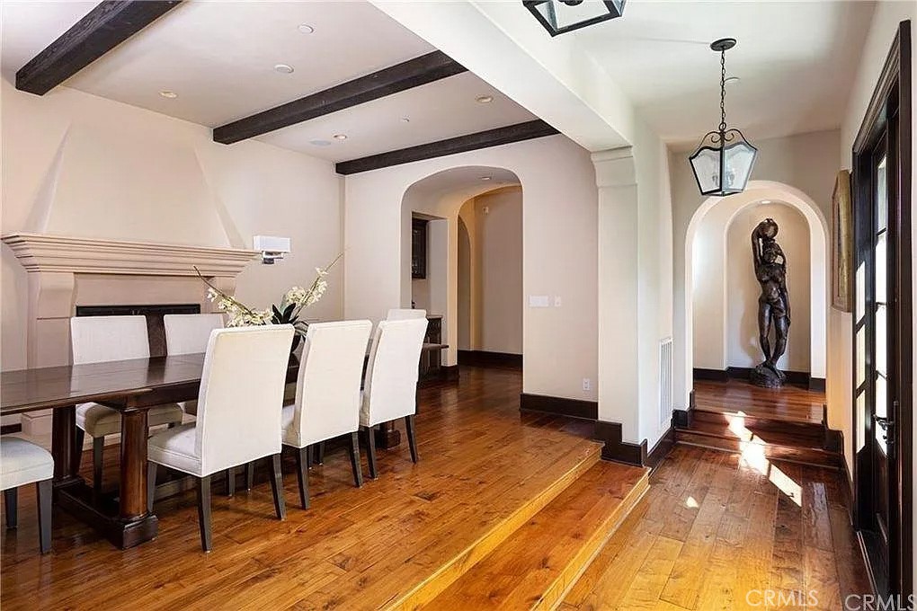 59 Vernal Spring Irvine, CA 92603 - Photo 15 of 33 a view of a dining room with furniture window and wooden floor